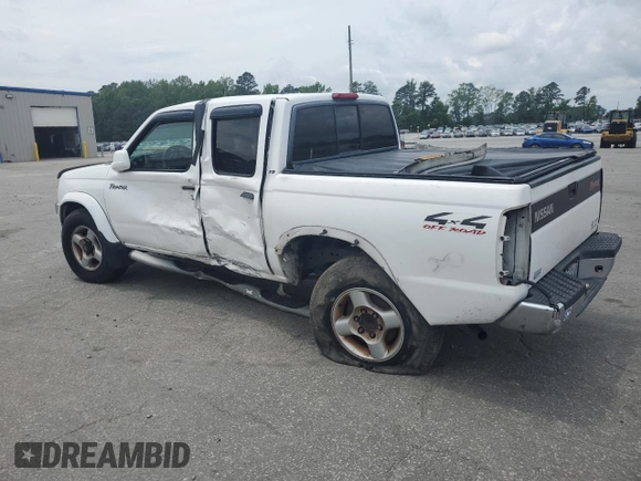 2000 Nissan Frontier XE with VIN 1N6ED27Y6YC334154, listed as a Copart auction lot 54140454 with 330,552 mi miles and Salvage title. Bid and sale history available at DreamBid. Image 2.