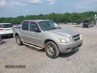 2003 Ford Explorer Sport Trac XLS z VIN 1FMZU77E73UB97392, wystawiony jako IAAI lot #42400398 z przebiegiem 160 556 mil mil oraz . Historia ofert i sprzedaży dostępna na DreamBid. Obrazek 1.