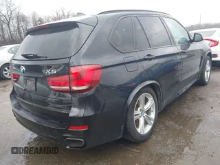2014 BMW X5 xDrive50i with VIN 5UXKR6C59E0C03597, listed as a IAAI auction lot 41866944 with 65,890 mi miles. Bid and sale history available at carsss.com. Image 4.