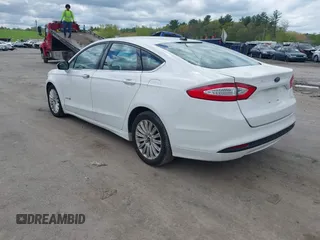 2013 Ford Fusion SE Hybrid with VIN 3FA6P0LUXDR328784, listed as a IAAI auction lot 42231399 with 169,462 mi miles and . Bid and sale history available at carsss.com. Image 3.