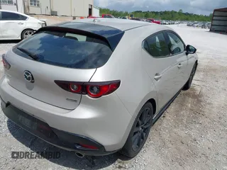 2022 Mazda Mazda3 Hatchback Premium with VIN JM1BPAML5N1507556, listed as a IAAI auction lot 42087802 with 56,507 mi miles. Bid and sale history available at carsss.com. Image 4.