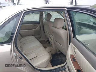 2001 Toyota Avalon XL w/Bucket Seats with VIN 4T1BF28B91U173868, listed as a IAAI auction lot 41721904 with 325,097 mi miles. Bid and sale history available at carsss.com. Image 8.