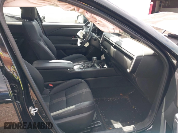2024 Mazda CX-50 S Premium with VIN 7MMVABDM0RN185128, listed as a IAAI auction lot 42383177 with 21,267 mi miles and . Bid and sale history available at DreamBid. Image 5.
