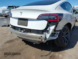 2020 Tesla Model 3 Standard Range Plus with VIN 5YJ3E1EA4LF644967, listed as a IAAI auction lot 41745984 with 23,479 mi miles and . Bid and sale history available at DreamBid. Image 6.