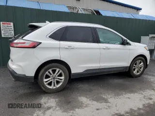 2020 Ford Edge SEL z VIN 2FMPK3J90LBB01559, wystawiony jako Copart lot #61365305 z przebiegiem 120 050 mil mil oraz Czysty tytuł • Clean title. Historia ofert i sprzedaży dostępna na DreamBid. Obrazek 3.