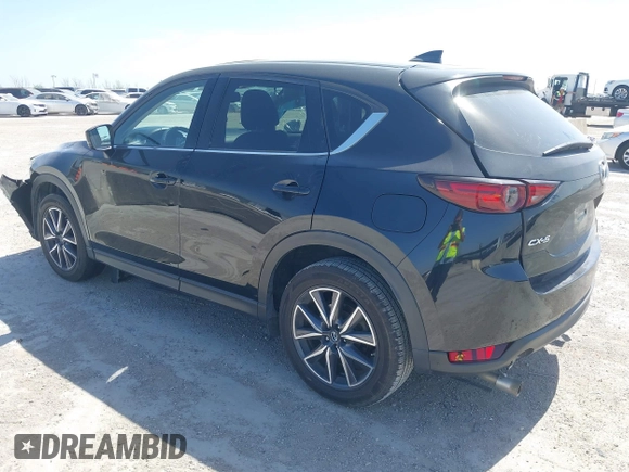2018 Mazda CX-5 Grand Touring with VIN JM3KFADM8J0330035, listed as a IAAI auction lot 41878680 with 62,632 mi miles. Bid and sale history available at carsss.com. Image 3.
