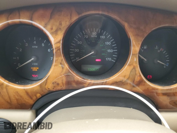 1999 Jaguar XJ with VIN SAJHX1040XC864208, listed as a Copart auction lot 59748585 with 130,577 mi miles and Clean title. Bid and sale history available at DreamBid. Image 9.