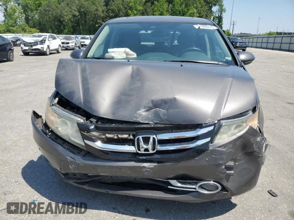 2014 Honda Odyssey Touring with VIN 5FNRL5H93EB061754, listed as a Copart auction lot 55182015 with 168,058 mi miles and Salvage title. Bid and sale history available at DreamBid. Image 5.