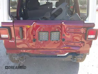 2021 Jeep Wrangler Unlimited Sport S z VIN 1C4HJXDG4MW647164, wystawiony jako IAAI lot #40952672 z przebiegiem 51 366 mil mil oraz . Historia ofert i sprzedaży dostępna na DreamBid. Obrazek 6.
