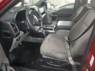 2015 Ford F-150 XLT with VIN 1FTEW1EP7FFC49319, listed as a Copart auction lot 56142895 with 125,052 mi miles and Salvage title. Bid and sale history available at DreamBid. Image 7.