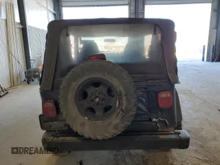 2002 Jeep Wrangler Sport with VIN 1J4FA49S82P713459, listed as a Copart auction lot 52745955 with 173,297 mi miles and Salvage Title. Bid and sale history available at carsss.com. Image 6.