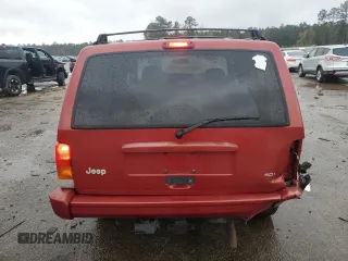 1999 Jeep Cherokee Sport with VIN 1J4FT68S1XL601799, listed as a Copart auction lot 83881844 with 203,572 mi miles and Salvage title. Bid and sale history available at DreamBid. Image 6.