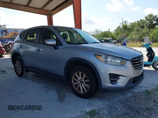 2016 Mazda CX-5 Sport z VIN JM3KE4BY5G0617707, wystawiony jako IAAI lot #42196260 z przebiegiem 203 920 mil mil oraz . Historia ofert i sprzedaży dostępna na DreamBid. Obrazek 1.