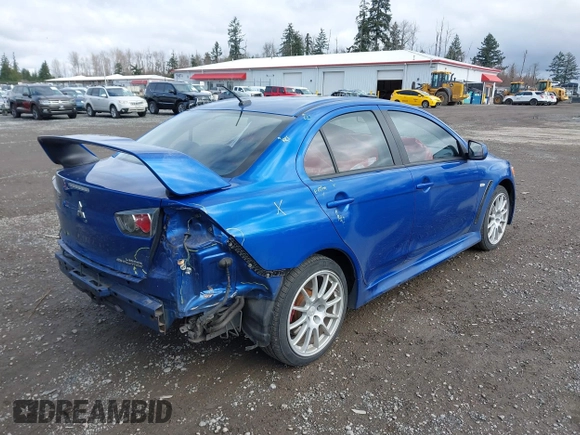 2015 Mitsubishi Lancer Evolution GSR with VIN JA32W8FV4FU012578, listed as a IAAI auction lot 41730742 with 64,762 mi miles. Bid and sale history available at carsss.com. Image 4.