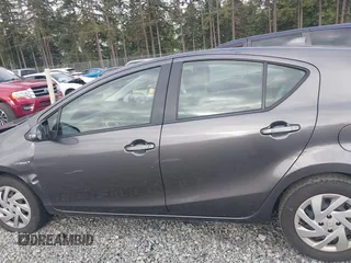 2015 Toyota Prius One z VIN JTDKDTB32F1575905, wystawiony jako IAAI lot #42152447 z przebiegiem 141 061 mil mil oraz . Historia ofert i sprzedaży dostępna na DreamBid. Obrazek 14.