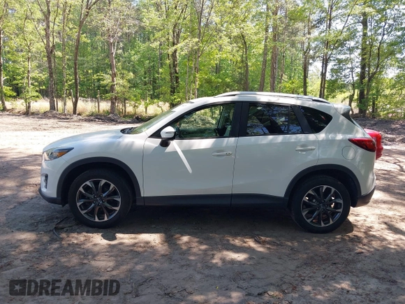 2016 Mazda CX-5 Grand Touring with VIN JM3KE2DY0G0870077, listed as a IAAI auction lot 42158225 with 93,816 mi miles. Bid and sale history available at carsss.com. Image 14.