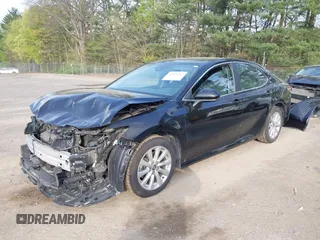 2020 Toyota Camry LE with VIN 4T1C11AK2LU393699, listed as a IAAI auction lot 42123267 with 66,932 mi miles and . Bid and sale history available at carsss.com. Image 2.