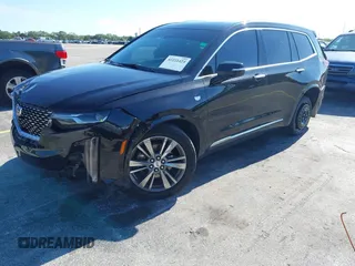 2020 Cadillac XT6 FWD Premium Luxury with VIN 1GYKPCRS7LZ211197, listed as a IAAI auction lot 42231424 with 57,351 mi miles and . Bid and sale history available at DreamBid. Image 2.
