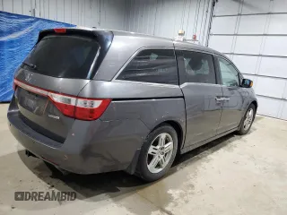 2013 Honda Odyssey Touring with VIN 5FNRL5H91DB024040, listed as a Copart auction lot 57241615 with 163,788 mi miles and Salvage title. Bid and sale history available at DreamBid. Image 3.