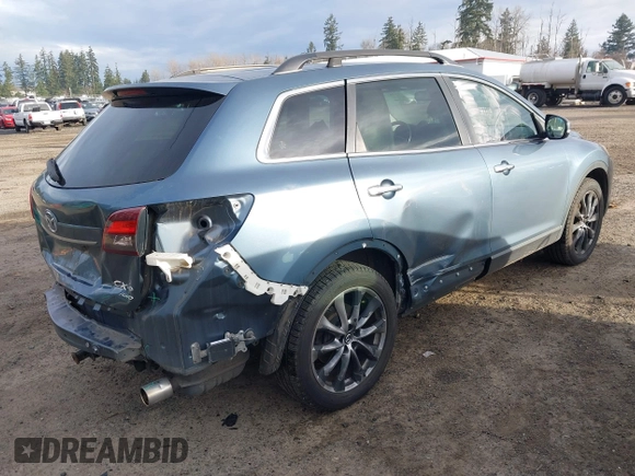 2014 Mazda CX-9 Grand Touring with VIN JM3TB3DV2E0435230, listed as a IAAI auction lot 41041440 with 145,538 mi miles and . Bid and sale history available at DreamBid. Image 4.