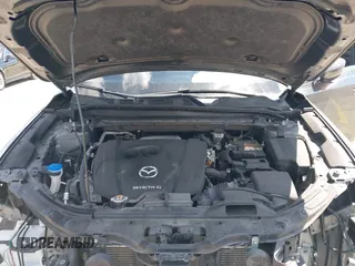 2020 Mazda CX-5 Touring with VIN JM3KFACM9L0826742, listed as a IAAI auction lot 41903755 with 73,409 mi miles and . Bid and sale history available at DreamBid. Image 10.