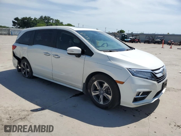 2019 Honda Odyssey Touring with VIN 5FNRL6H86KB089055, listed as a Copart auction lot 56980975 with 154,842 mi miles and Salvage title. Bid and sale history available at DreamBid. Image 4.