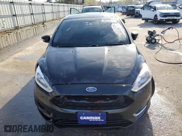 2016 Ford Focus Titanium with VIN 1FADP3J22GL201721, listed as a Copart auction lot 50633795 with 29,801 mi miles and Salvage title. Bid and sale history available at DreamBid. Image 5.
