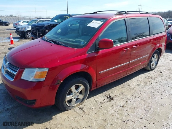 2009 Dodge Grand Caravan SXT with VIN 2D8HN54129R670027, listed as a IAAI auction lot 41740126 with 143,490 mi miles. Bid and sale history available at carsss.com. Image 2.