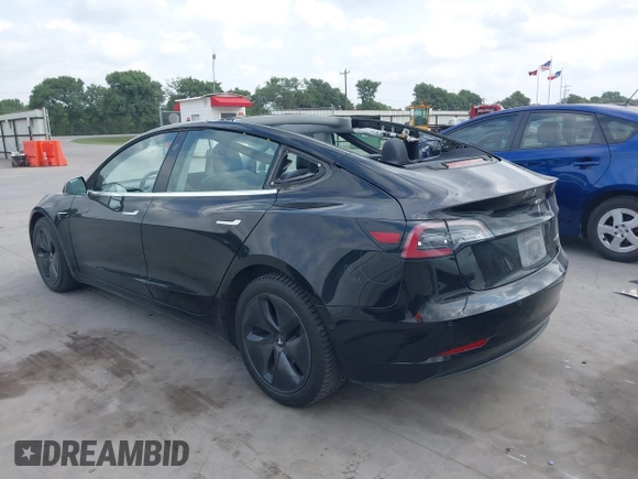 2018 Tesla Model 3 Long Range Battery z VIN 5YJ3E1EB3JF178812, wystawiony jako IAAI lot #42124838 z przebiegiem 124 229 mil mil oraz . Historia ofert i sprzedaży dostępna na DreamBid. Obrazek 3.