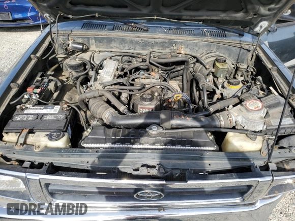 1993 Toyota Pickup DX z VIN JT4RN01P3P7060439, wystawiony jako Copart lot #57356125 z przebiegiem 259 773 mil mil oraz Szkoda całkowita • Salvage title. Historia ofert i sprzedaży dostępna na DreamBid. Obrazek 11.