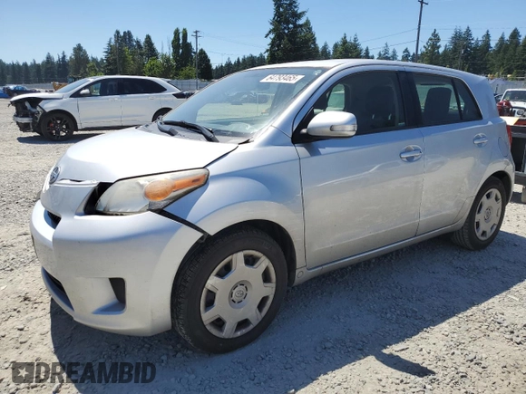 2013 Scion xD with VIN JTKKUPB43D1032634, listed as a Copart auction lot 64793465 with 74,065 mi miles and Salvage title. Bid and sale history available at DreamBid. Image 1.