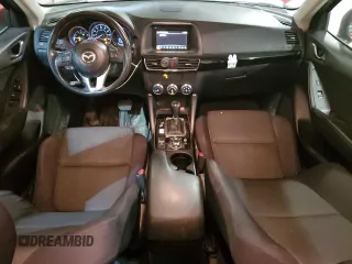 2016 Mazda CX-5 Sport z VIN JM3KE4BY9G0824021, wystawiony jako Copart lot #52392345 z przebiegiem 121 990 mil mil oraz Szkoda całkowita • Salvage title. Historia ofert i sprzedaży dostępna na DreamBid. Obrazek 8.