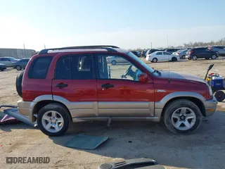 2002 Suzuki Grand Vitara JLX with VIN JS3TD62V824152943, listed as a IAAI auction lot 41668395 with 104,191 mi miles. Bid and sale history available at carsss.com. Image 14.