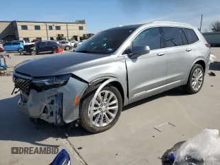 2023 Cadillac XT6 FWD Premium Luxury with VIN 1GYKPCRS4PZ124119, listed as a Copart auction lot 87836515 with 14,752 mi miles and Salvage Title. Bid and sale history available at carsss.com. Image 1.