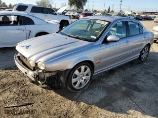 2005 Jaguar X-Type 3.0L with VIN SAJWA51C55WE31701, listed as a Copart auction lot 82908594 with 186,332 mi miles and Salvage Title. Bid and sale history available at carsss.com. Image 1.