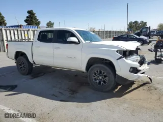 2022 Toyota Tacoma 4WD SR with VIN 3TMCZ5AN6NM462044, listed as a Copart auction lot 47292755 with 64,596 mi miles and Salvage Title. Bid and sale history available at carsss.com. Image 4.