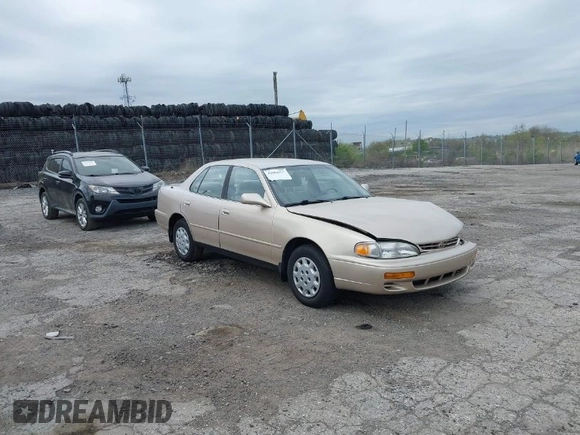1996 Toyota Camry DX with VIN 4T1BG12K7TU813773, listed as a IAAI auction lot 42084977 with 49,453 mi miles. Bid and sale history available at carsss.com. Image 1.