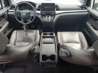 2019 Honda Odyssey Touring z VIN 5FNRL6H80KB501681, wystawiony jako Copart lot #58814945 z przebiegiem 105 287 mil mil oraz Szkoda całkowita • Salvage title. Historia ofert i sprzedaży dostępna na DreamBid. Obrazek 8.