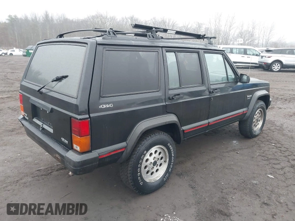 1995 Jeep Cherokee Sport with VIN 1J4FJ68S7SL572730, listed as a IAAI auction lot 41474520 with 189,907 mi miles. Bid and sale history available at carsss.com. Image 4.