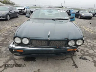 1996 Jaguar XJ with VIN SAJHX1741TC758740, listed as a Copart auction lot 73377914 with 140,964 mi miles and Salvage title. Bid and sale history available at DreamBid. Image 5.
