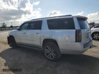 2015 Chevrolet Suburban LS with VIN 1GNSCHKC0FR142513, listed as a Copart auction lot 77311994 with 185,263 mi miles and Salvage Title. Bid and sale history available at carsss.com. Image 2.