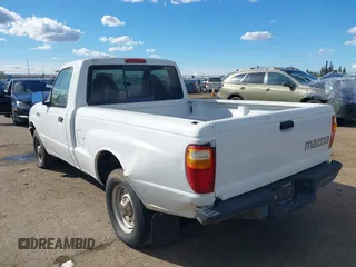2002 Mazda B-Series 2WD Truck SX with VIN 4F4YR12D42TM18276, listed as a IAAI auction lot 41723184 with 142,623 mi miles. Bid and sale history available at carsss.com. Image 3.