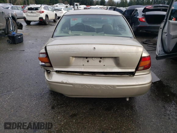 2001 Saturn SL z VIN 1G8ZH52851Z286886, wystawiony jako Copart lot #84883824 z przebiegiem Nie podano mil oraz Szkoda całkowita • Salvage title. Historia ofert i sprzedaży dostępna na DreamBid. Obrazek 6.
