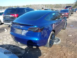 2023 Tesla Model 3 Long Range with VIN 5YJ3E1EB0PF688172, listed as a IAAI auction lot 41411580 with 21,125 mi miles and . Bid and sale history available at DreamBid. Image 4.