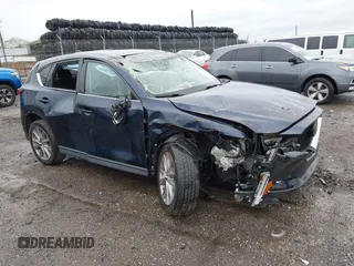 2019 Mazda CX-5 Grand Touring with VIN JM3KFBDM6K0592496, listed as a IAAI auction lot 41730103 with Not Provided miles and . Bid and sale history available at carsss.com. Image 1.