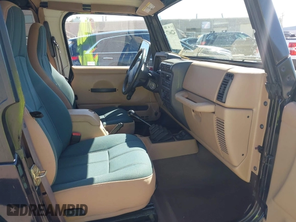 2001 Jeep Wrangler Sahara z VIN 1J4FA59S41P313113, wystawiony jako IAAI lot #42266173 z przebiegiem 125 792 mil mil oraz . Historia ofert i sprzedaży dostępna na DreamBid. Obrazek 5.