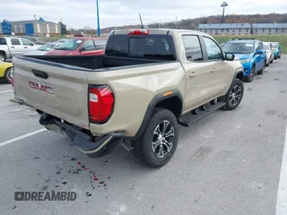 2024 GMC Canyon 4WD AT4 with VIN 1GTP6DEK8R1179023, listed as a IAAI auction lot 40930724 with 3,235 mi miles. Bid and sale history available at carsss.com. Image 4.
