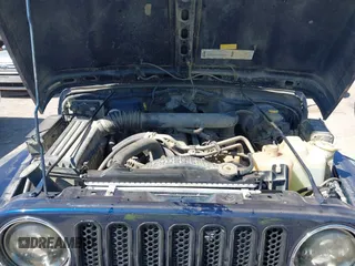 2000 Jeep Wrangler Sport with VIN 1J4FA49S0YP770943, listed as a IAAI auction lot 41817600 with 165,379 mi miles. Bid and sale history available at carsss.com. Image 10.
