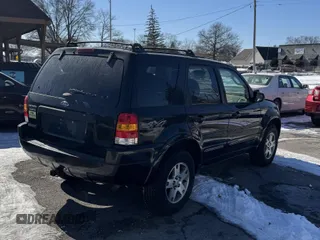 2004 Ford Escape Limited with VIN 1FMCU94144KA88842, listed as a IAAI auction lot 41643194 with 148,082 mi miles. Bid and sale history available at carsss.com. Image 4.