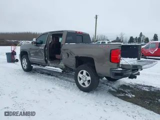 2015 Chevrolet Silverado 2500HD Built After Aug 14 High Country with VIN 1GC1KXE89FF543780, listed as a IAAI auction lot 41557608 with 164,171 mi miles. Bid and sale history available at carsss.com. Image 3.